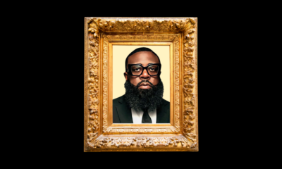 E. Tony Gaines in a golden frame with dark black background